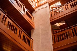 a spiral staircase in a building with wooden walls at Hotel Molika in Magarevo