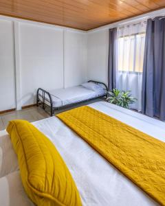 Кровать или кровати в номере Casa kattleya