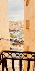 a view of a harbor from a balcony at Marina View 34 in Birgu