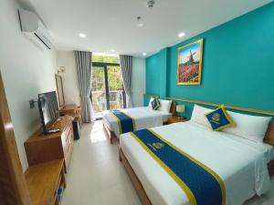 Postel nebo postele na pokoji v ubytování Golden Rose Hotel + 37 fotografií