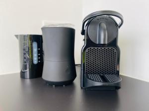 a black and white appliance sitting on a table at Das Bad Wiessee 22 in Bad Wiessee