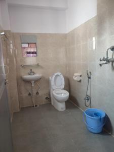 A bathroom at Krishna Inn