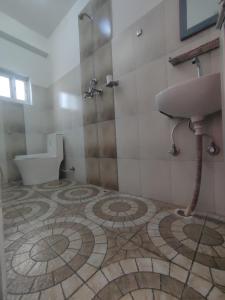 A bathroom at Krishna Inn