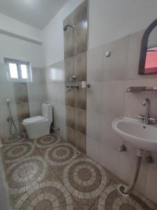 A bathroom at Krishna Inn