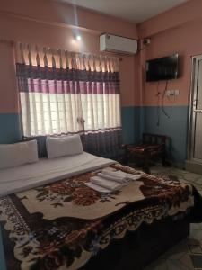 A television and/or entertainment centre at Krishna Inn