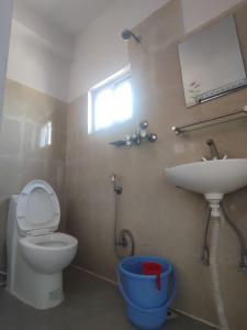 A bathroom at Krishna Inn