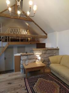 Posezení v ubytování Superbe appartement dans charmant corps de ferme