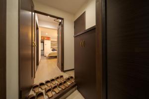 a room with a hallway with a row of wine bottles at Tabi no yado Hanakeshiki Botan 4th floor - Vacation STAY 43035v in Yufu