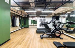 a gym with a treadmill and a elliptical bike at Cozy 2BR Loft in the Heart of Miraflores in Lima