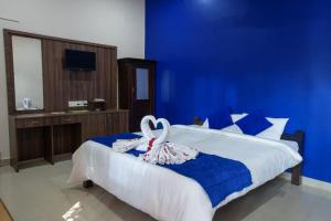 Postel nebo postele na pokoji v ubytování Paradise Auro Resort