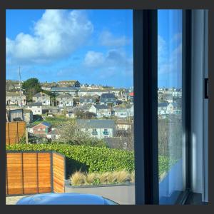a view of a city from a window at Uno St Ives - Luxury Serviced Accommodation in St Ives