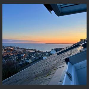 a view of the ocean from the roof of a house at Uno St Ives - Luxury Serviced Accommodation in St Ives