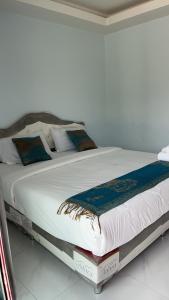 A bed or beds in a room at P&L21Resort