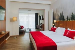 Postel nebo postele na pokoji v ubytování Hotel Drei Quellen Therme
