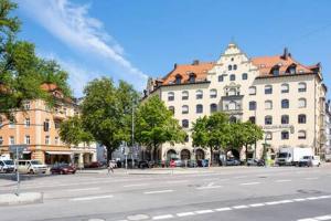 an empty street in a city with buildings at Oktoberfest Oasis for up to 12 in Munich