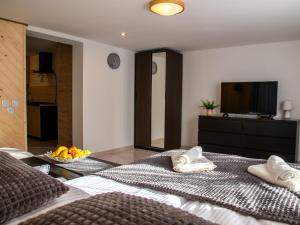 Posteľ alebo postele v izbe v ubytovaní Apartamenty Zakątek Harenda