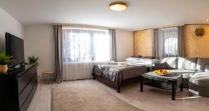 Posteľ alebo postele v izbe v ubytovaní Apartamenty Zakątek Harenda