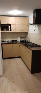 Kuchyňa alebo kuchynka v ubytovaní Apartamenty Zakątek Harenda