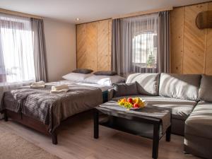 Posteľ alebo postele v izbe v ubytovaní Apartamenty Zakątek Harenda