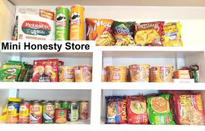 a refrigerator filled with lots of different types of food at Avida Iloilo Tower 3 411 in Iloilo City