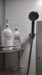 a bathroom with two soap bottles on a shelf at Mong House #Mangwon-dong Mangridangil 2F Private stay in Seoul