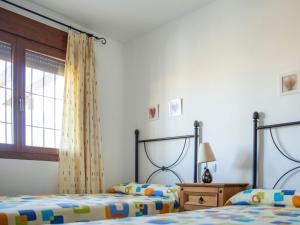 A bed or beds in a room at Apartment in Palomares near the Beach