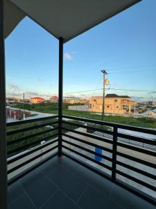 a view from the balcony of a building with a view at A modern townhouse at Farm in Georgetown