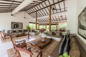 a living room with a couch and a table at Nyne Hotels - Mayur Lodge, Yala in Yala