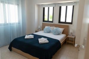 Ένα ή περισσότερα κρεβάτια σε δωμάτιο στο Oceans Breeze Villa +28 φωτογραφίες