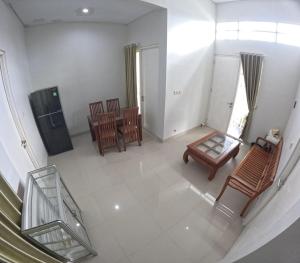 an overhead view of a living room with chairs and a table at GKR J8 Homestay Jogja in Pedes