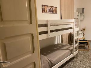 a room with a bunk bed and a bunk bed at La dimora nonna Eugy in Polignano a Mare