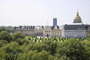 a view of the palace of versailles from the gardens at Rooftop Invalides in Paris