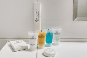 a group of products sitting on a bathroom counter at 149 Suite Christophe - Superbe Appartement à Paris in Paris