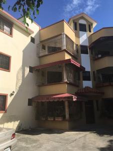 a building with balconies on the side of it at Comfortable and cute in Santo Domingo