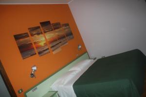 Postel nebo postele na pokoji v ubytování Hotel Valbrenta