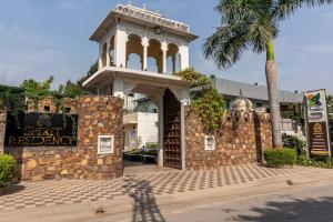 a building with a clock tower on top of it at Treebo Trend Spirit Residency in Udaipur