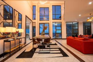 a living room with a red couch and a table at Entire Home in Sheffield Beach in Sheffield Beach