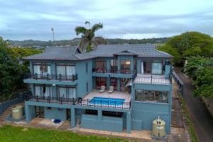 an aerial view of a blue house at Entire Home in Sheffield Beach in Sheffield Beach