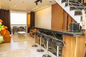 a bar in a room with a counter and stools at White Pyramids inn in Cairo
