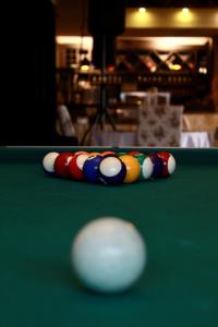a cue ball on top of a pool table at Hotel Opera Jaz in Budva