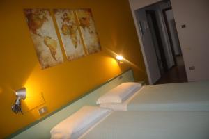 Postel nebo postele na pokoji v ubytování Hotel Valbrenta