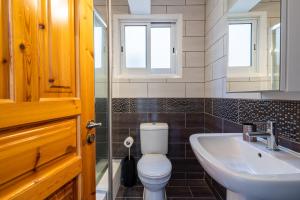 a bathroom with a toilet and a sink at Jayde 2-Bedroom Apartment in Larnaca in Larnaca +13 photos