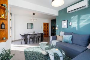 a living room with a couch and a table at Jayde 2-Bedroom Apartment in Larnaca in Larnaca