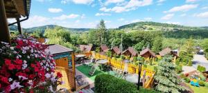 an aerial view of a resort with a garden at Zielone Wzgórza in Solina