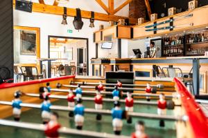 a group of figurines of a ping pong court at Hôtel-Club Côté Dole, USSIM Vacances Les Rousses in Les Rousses