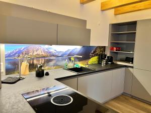 a kitchen with a view of a mountain at Wittichenauer Bleibe in Elsterheide