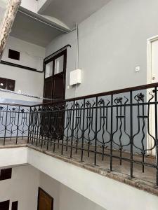 a balcony with wrought iron railings in a building at Apartament 2 pokoje, Przemyśl, 1 piętro in Przemyśl