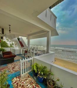a beach house with a view of the ocean at FLIPFLOPS BEACH SHACK in Mahabalipuram
