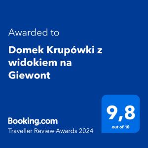 Ett certifikat, pris eller annat dokument som visas upp på Domek Krupówki z widokiem na Giewont