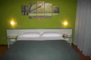 Postel nebo postele na pokoji v ubytování Hotel Valbrenta